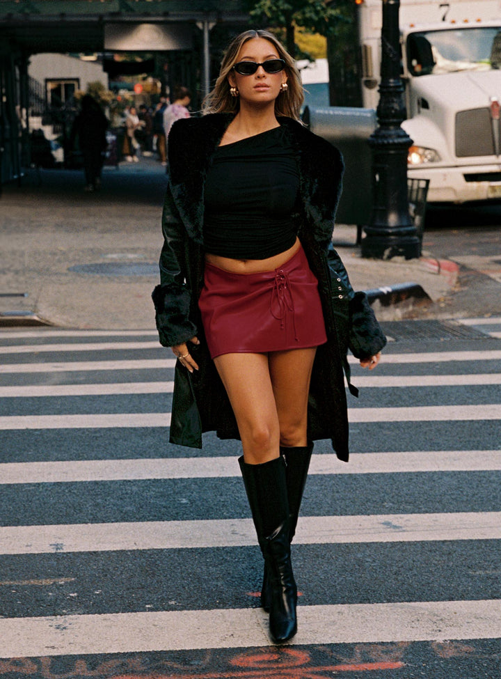 Kyla | Women’s long vegan leather coat with faux fur trim and waist belt