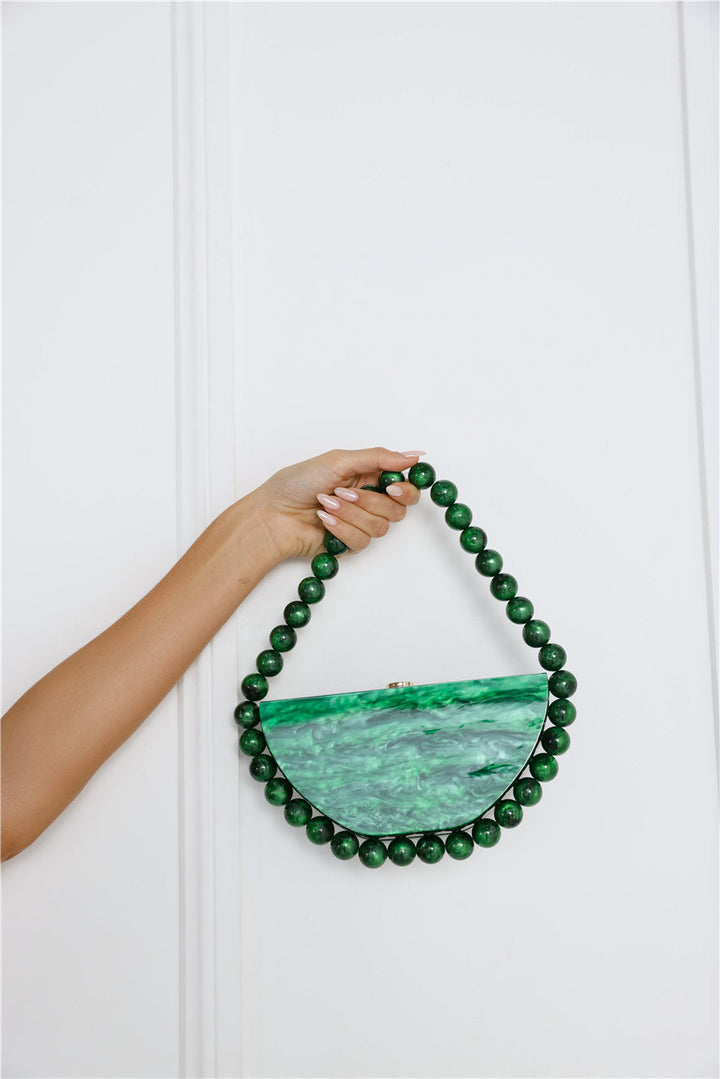 Charleen | Women’s acrylic clutch bag with pearl-like finish and beaded handle