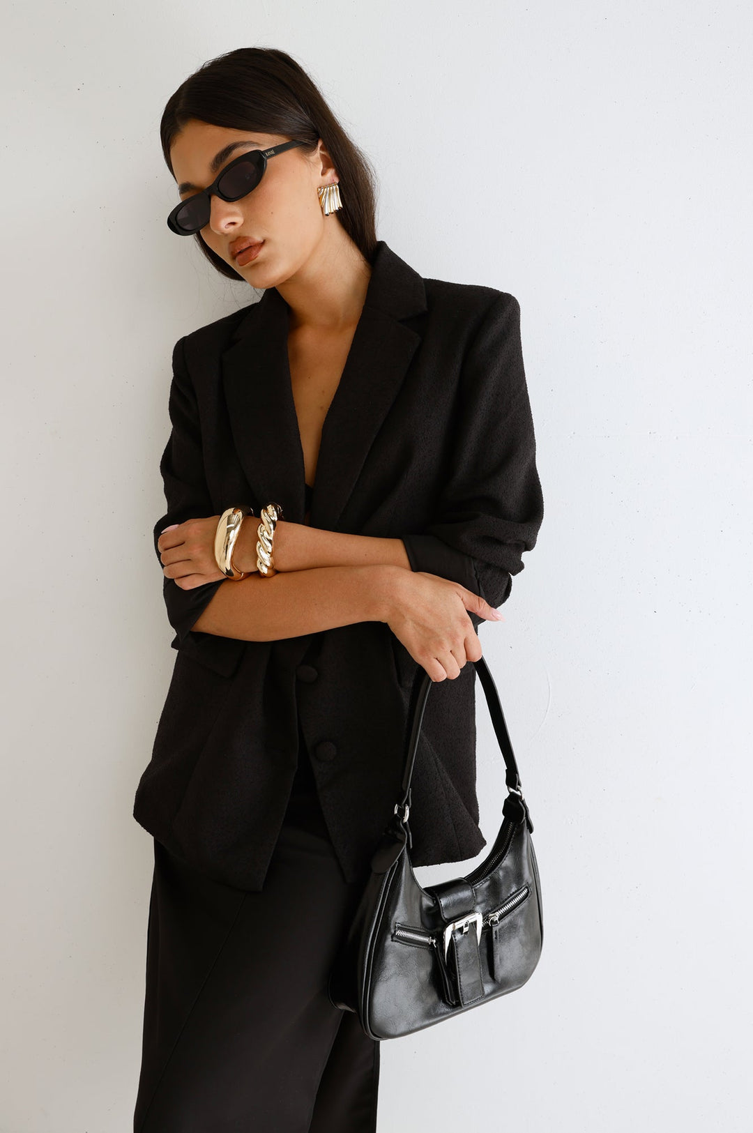 Anamarie | Women’s crescent shoulder bag with buckle detail and zip closure