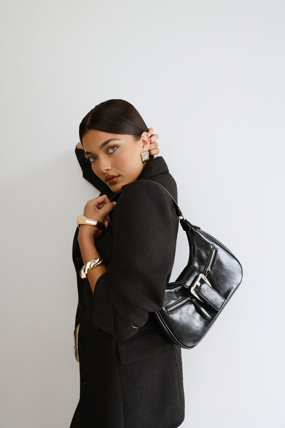 Anamarie | Women’s crescent shoulder bag with buckle detail and zip closure