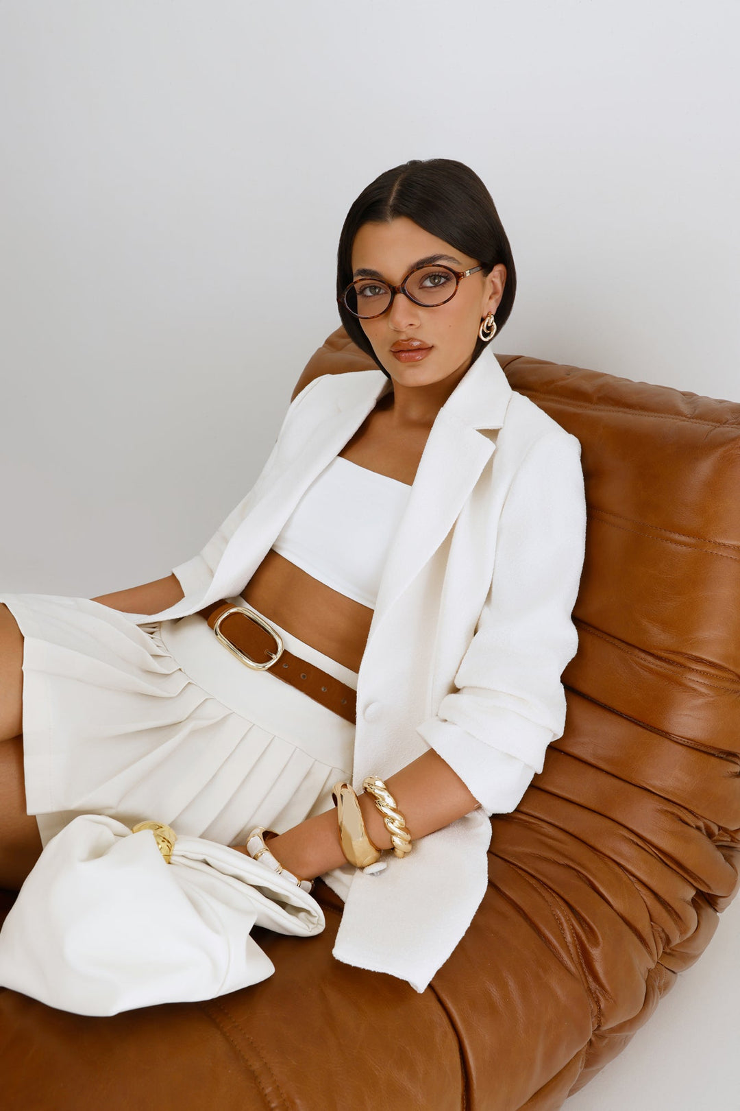 Pia | Women’s pouch handle bag with gold hardware detail