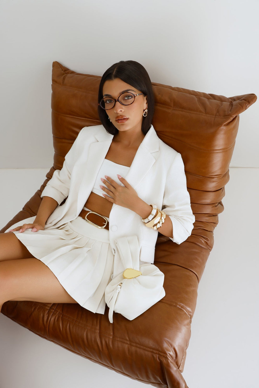 Pia | Women’s pouch handle bag with gold hardware detail