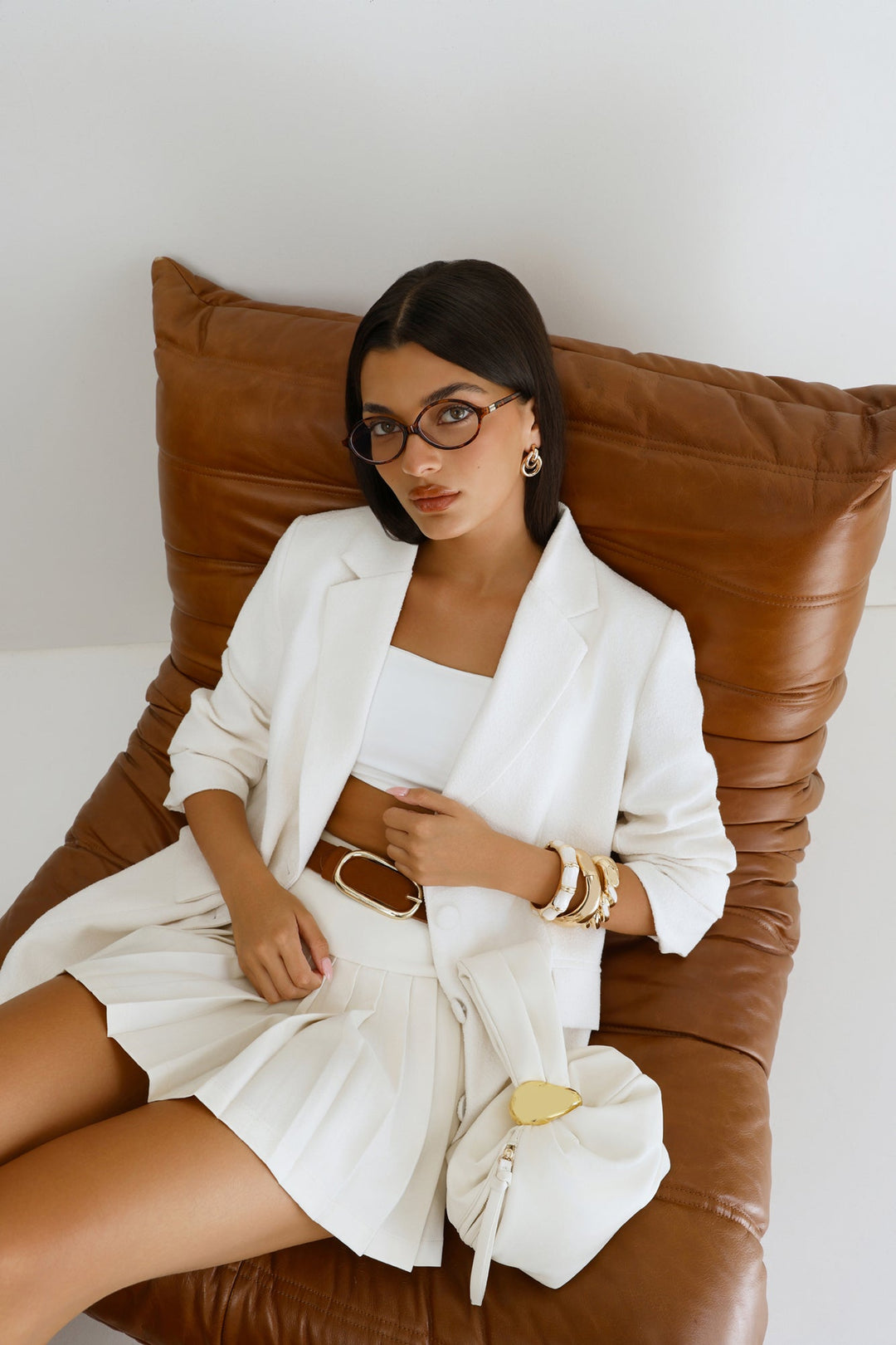 Pia | Women’s pouch handle bag with gold hardware detail