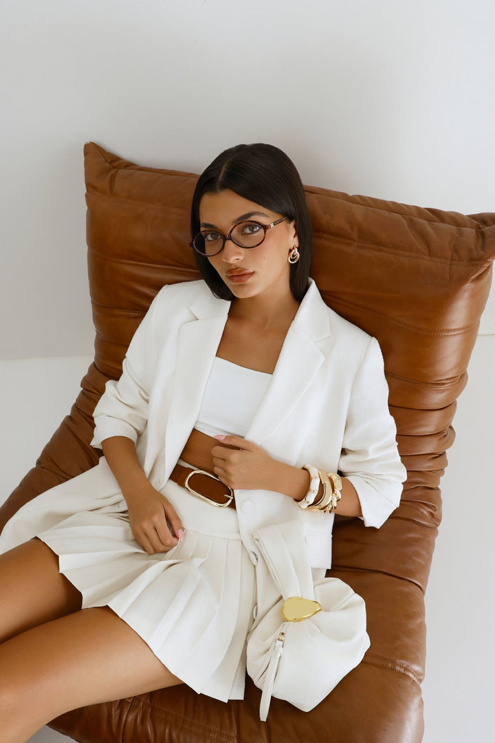 Pia | Women’s pouch handle bag with gold hardware detail