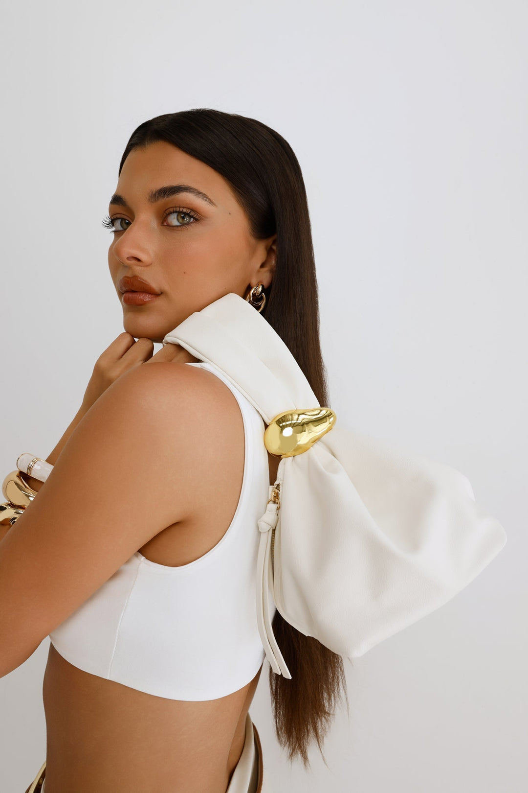 Pia | Women’s pouch handle bag with gold hardware detail