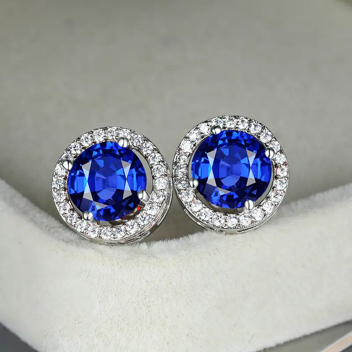 Luca | Women’s stud earrings with round blue stone and halo design