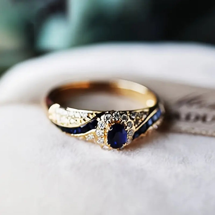 Eva | Women’s sapphire-inspired ring with gold band and crystal accents