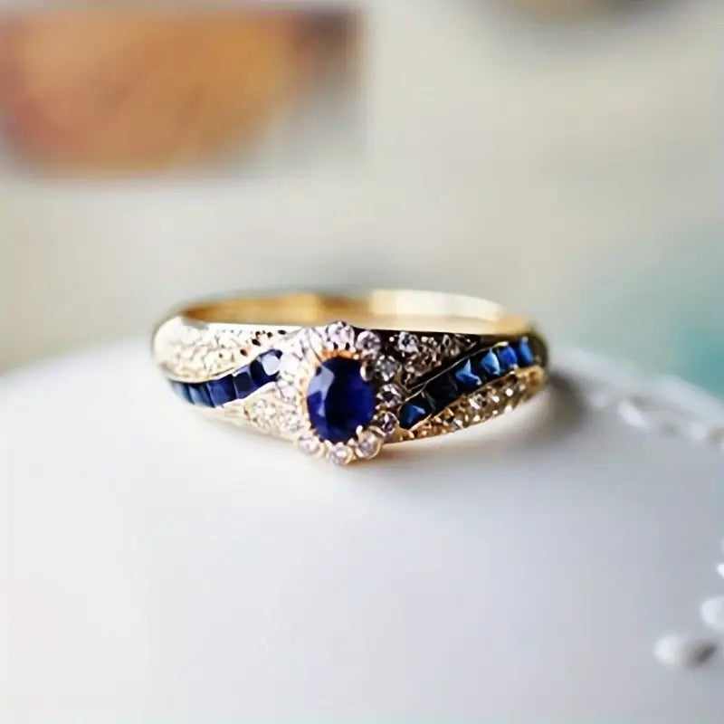 Eva | Women’s sapphire-inspired ring with gold band and crystal accents