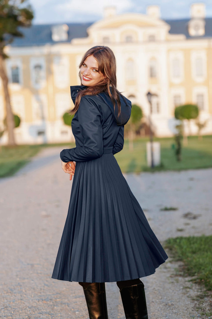 Arnita | Women’s elegant pleated trench coat with belted waist and removable hood