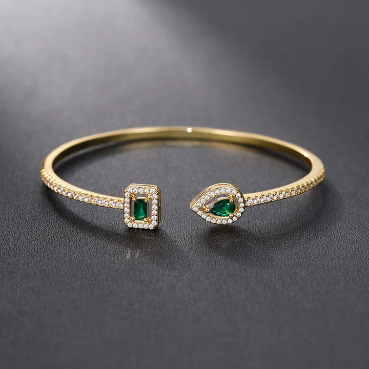 Heidi | Women’s open bangle bracelet with emerald stones and crystal accents