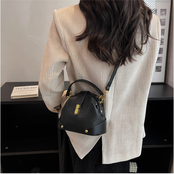 Patty | Women’s compact crossbody bag with contrast detail and top handle