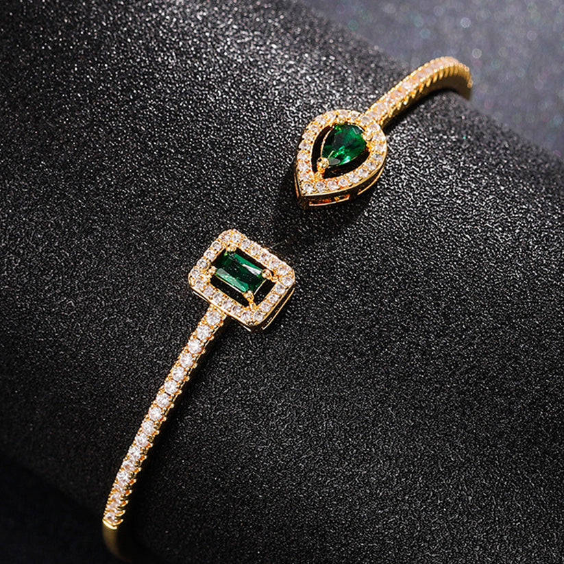 Heidi | Women’s open bangle bracelet with emerald stones and crystal accents