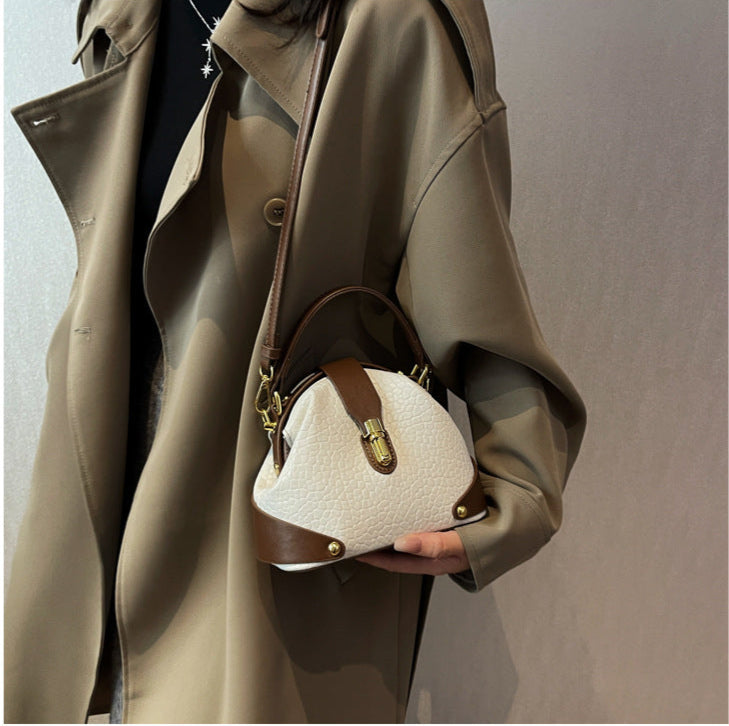 Patty | Women’s compact crossbody bag with contrast detail and top handle