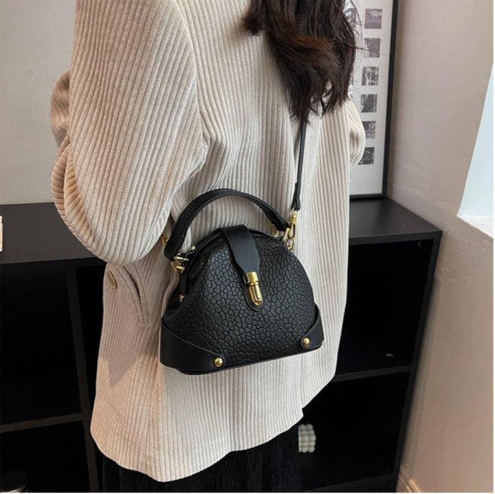 Patty | Women’s compact crossbody bag with contrast detail and top handle