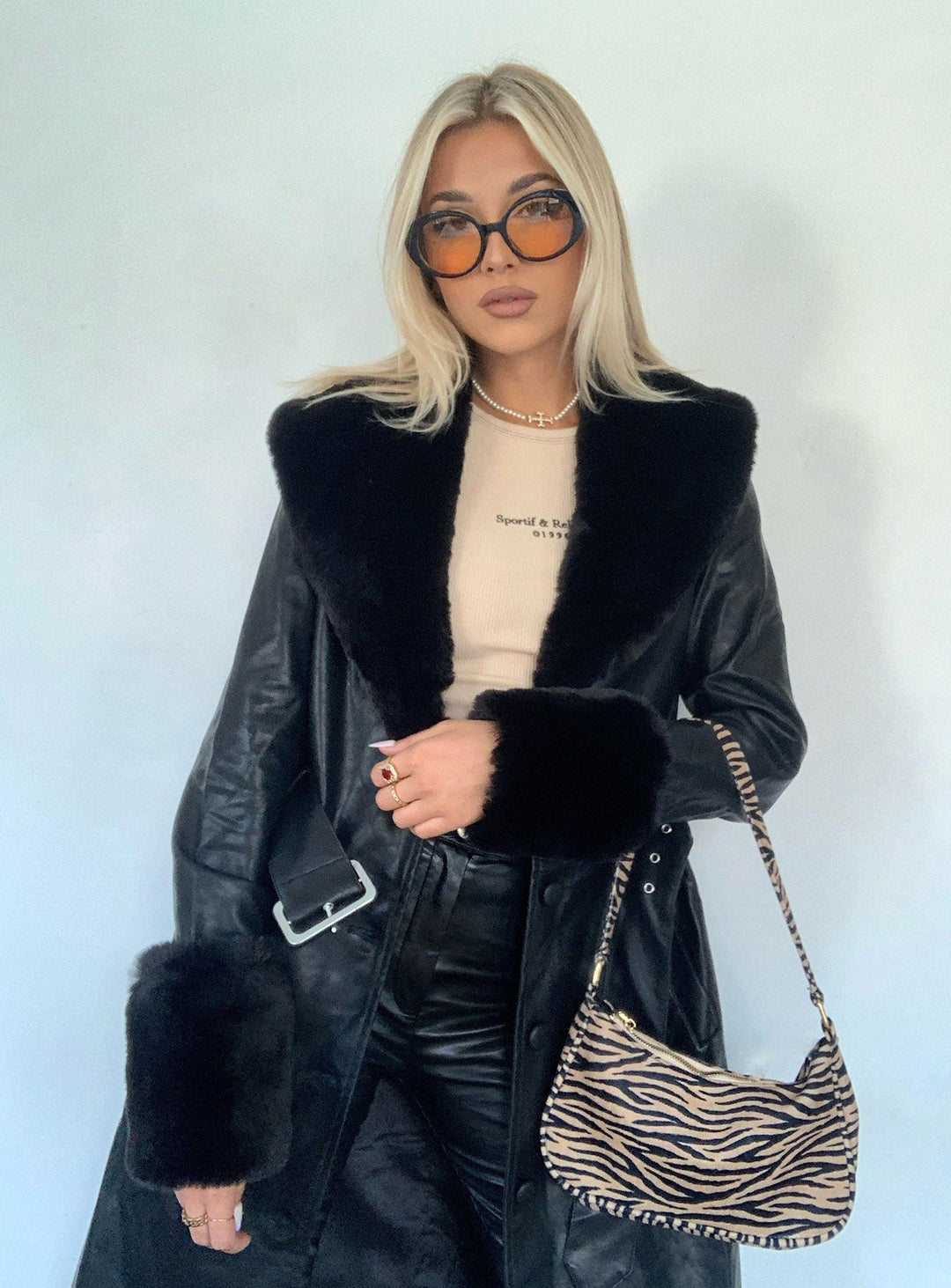 Kyla | Women’s long vegan leather coat with faux fur trim and waist belt