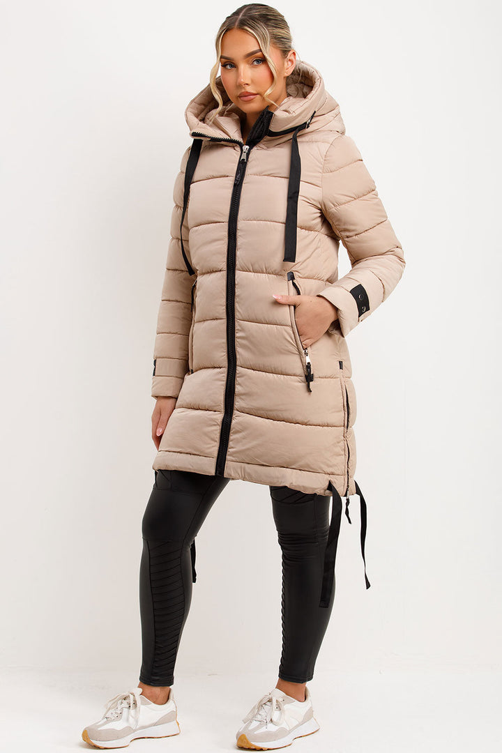 Mylenna | Women’s long puffer coat with hood and side straps