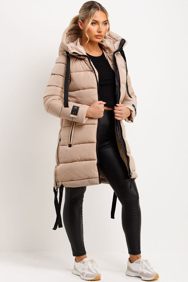 Mylenna | Women’s long puffer coat with hood and side straps