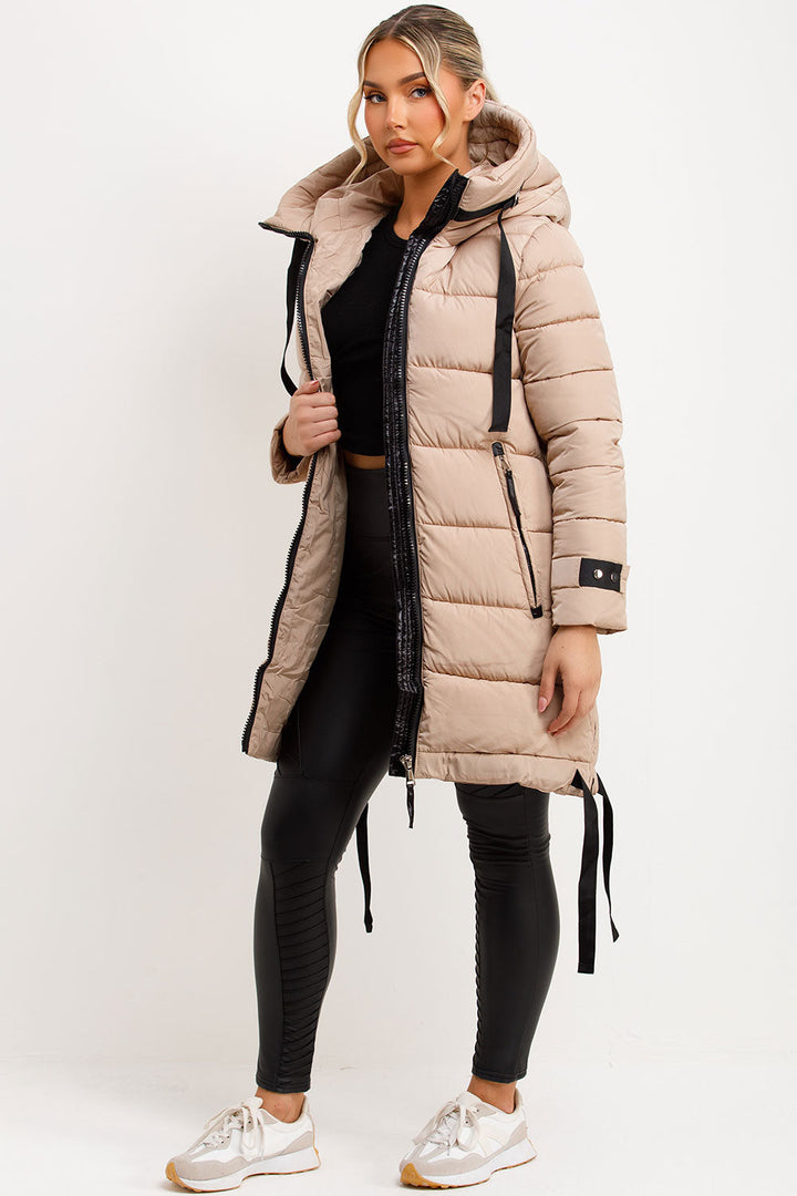 Mylenna | Women’s long puffer coat with hood and side straps