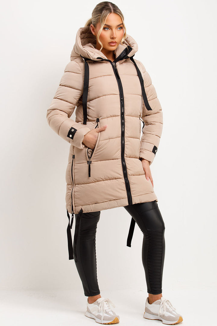 Mylenna | Women’s long puffer coat with hood and side straps