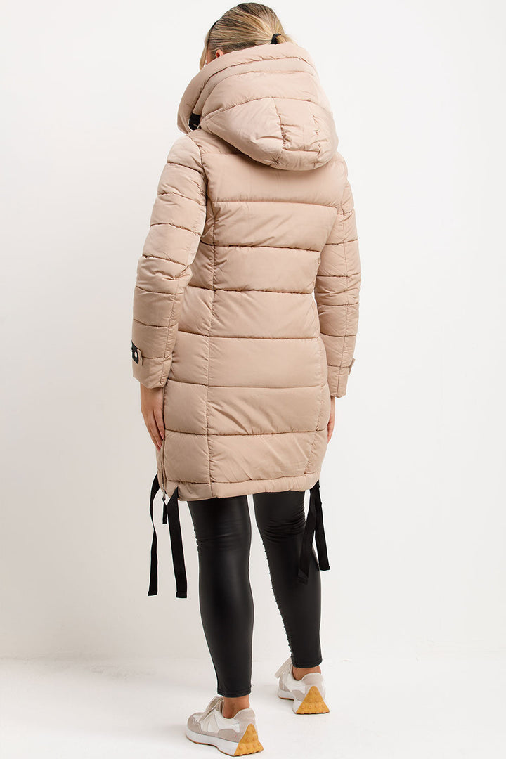 Mylenna | Women’s long puffer coat with hood and side straps