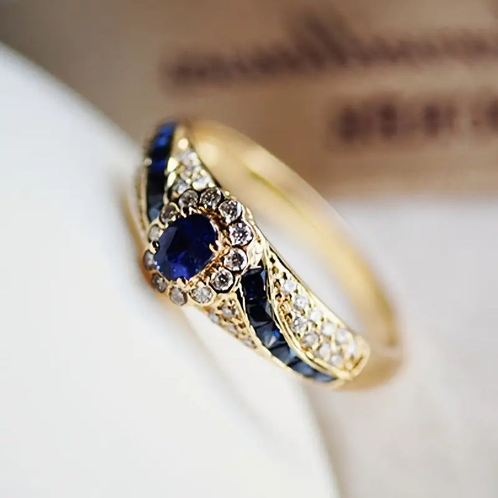 Eva | Women’s sapphire-inspired ring with gold band and crystal accents