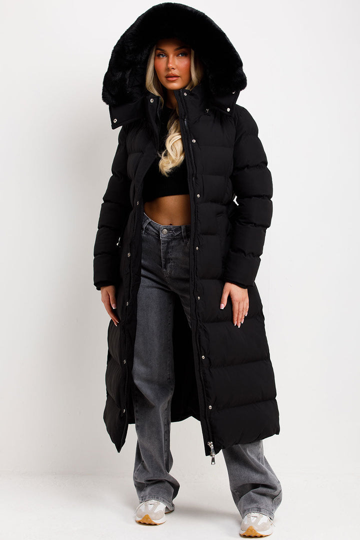 Corinne | Long puffer coat with faux fur hood and belt