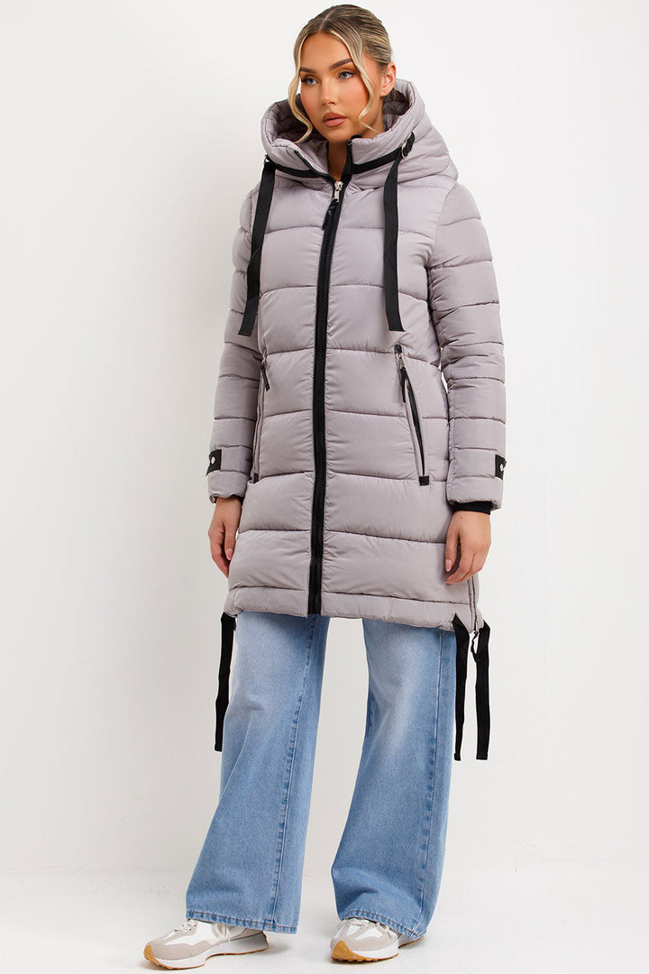 Ambriah | Women’s long puffer coat with hood and side straps