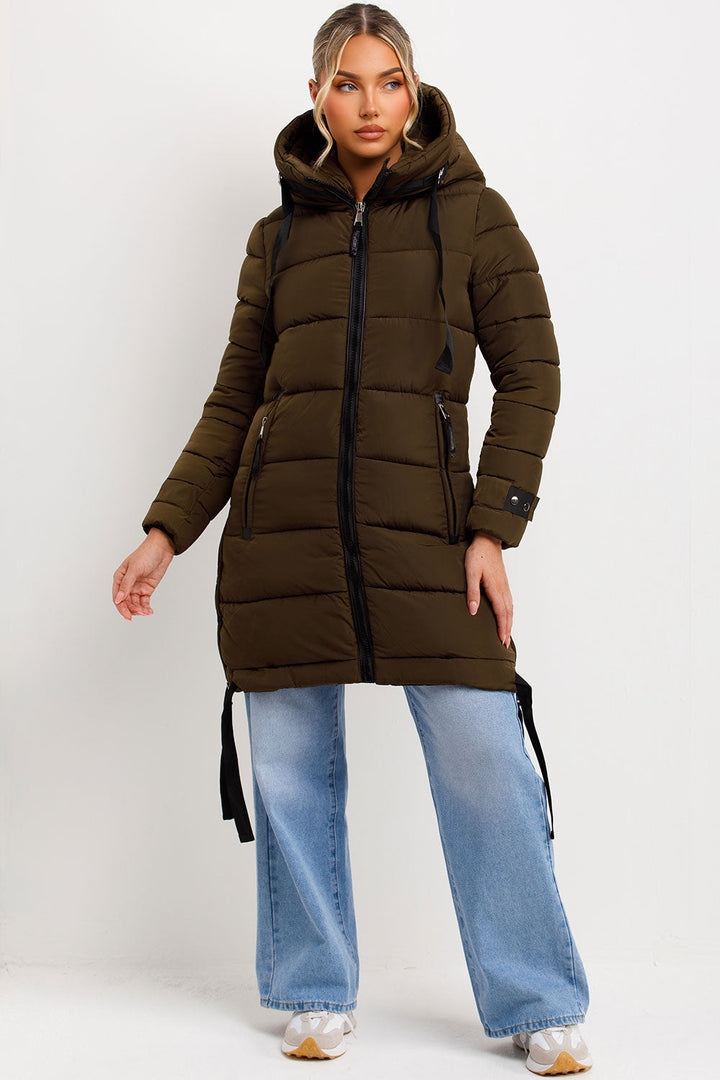 Kaeli | Women’s long puffer coat with hood and side straps