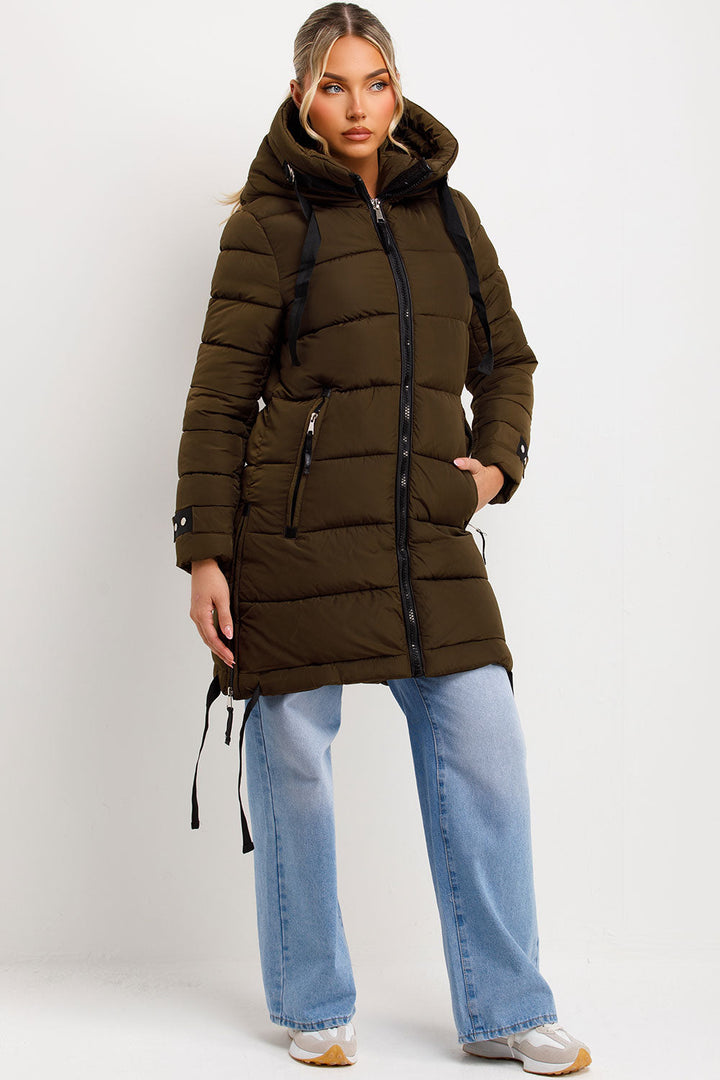 Kaeli | Women’s long puffer coat with hood and side straps