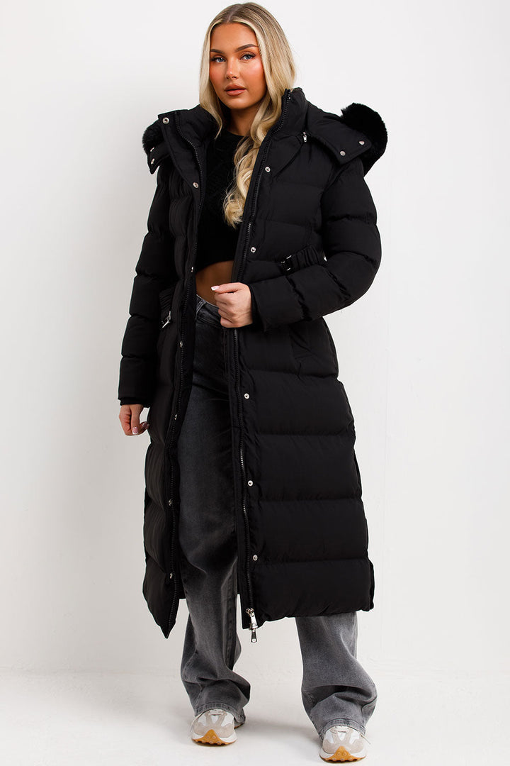 Corinne | Long puffer coat with faux fur hood and belt