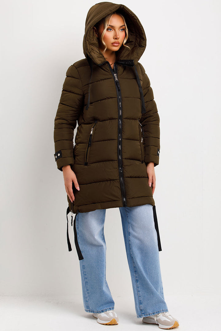 Kaeli | Women’s long puffer coat with hood and side straps