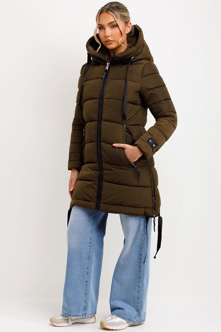 Kaeli | Women’s long puffer coat with hood and side straps