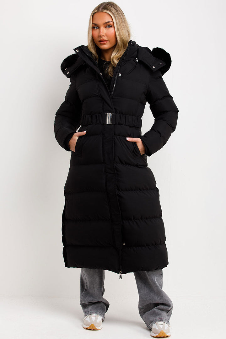 Corinne | Long puffer coat with faux fur hood and belt
