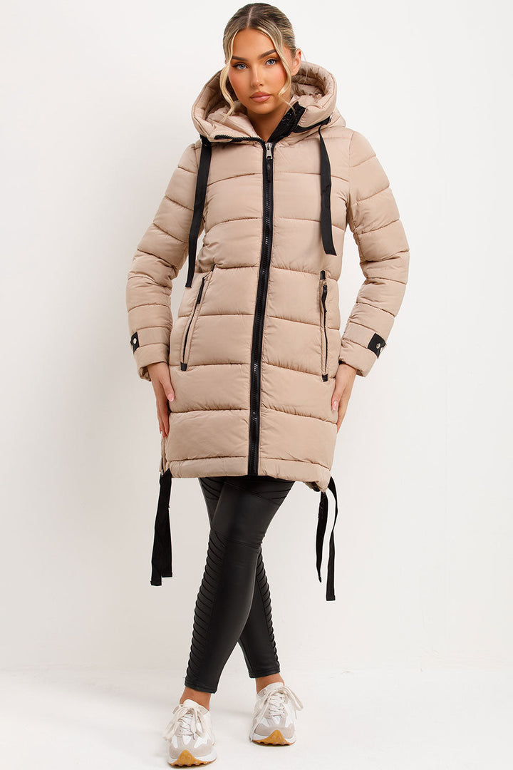 Mylenna | Women’s long puffer coat with hood and side straps
