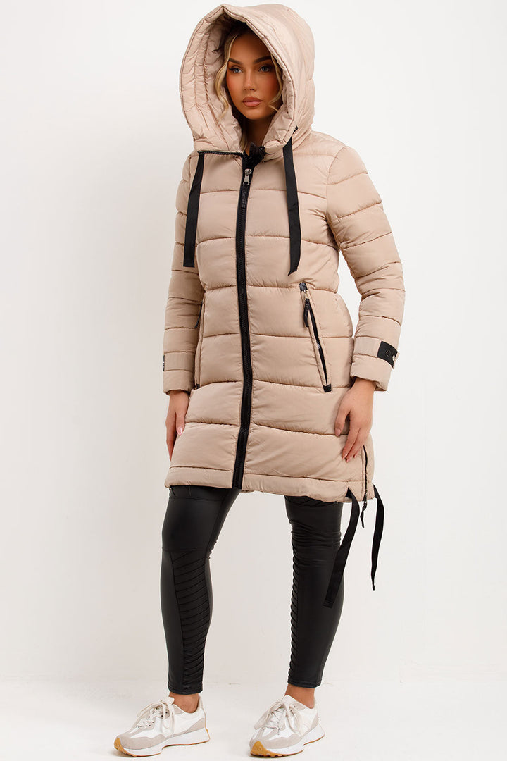 Mylenna | Women’s long puffer coat with hood and side straps