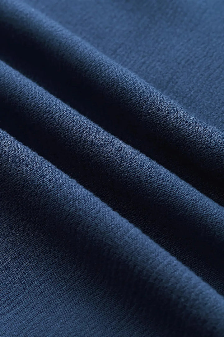 Hanah | Women’s halter jumpsuit with deep v neckline and pockets