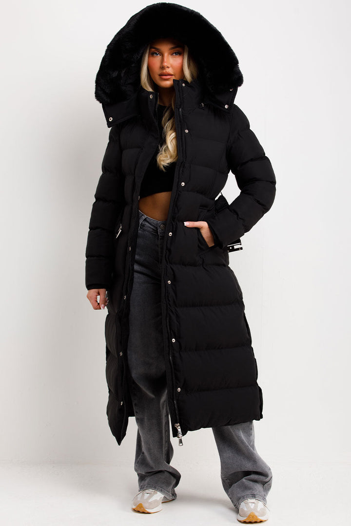 Corinne | Long puffer coat with faux fur hood and belt
