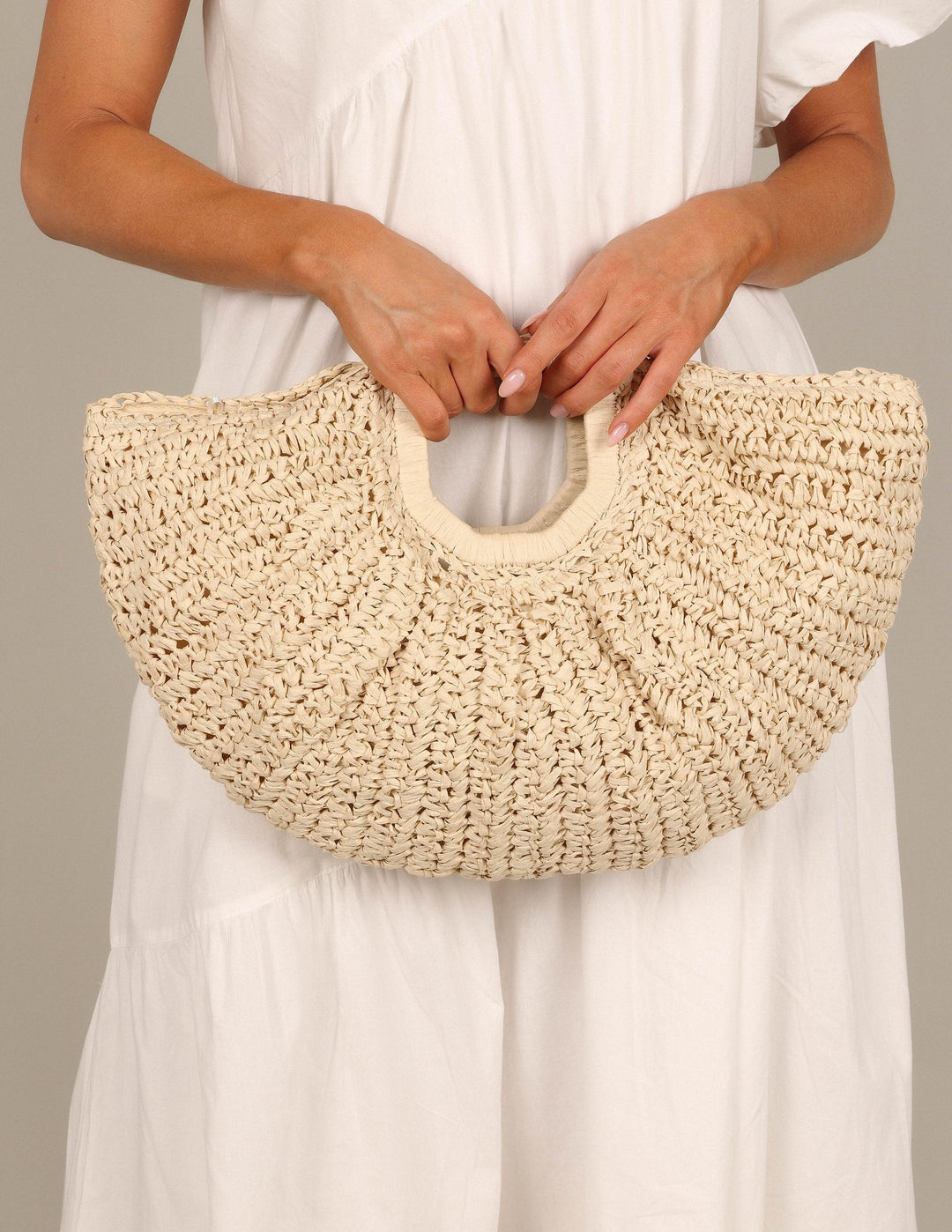 Dani | Women’s woven half-moon straw handbag