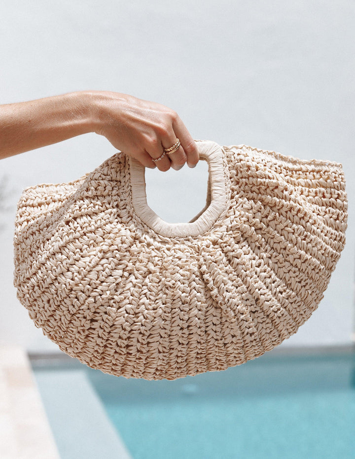 Dani | Women’s woven half-moon straw handbag