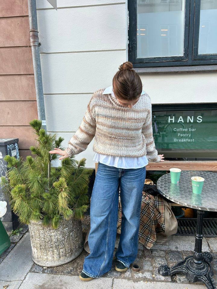 June | Women’s knit sweater with striped design