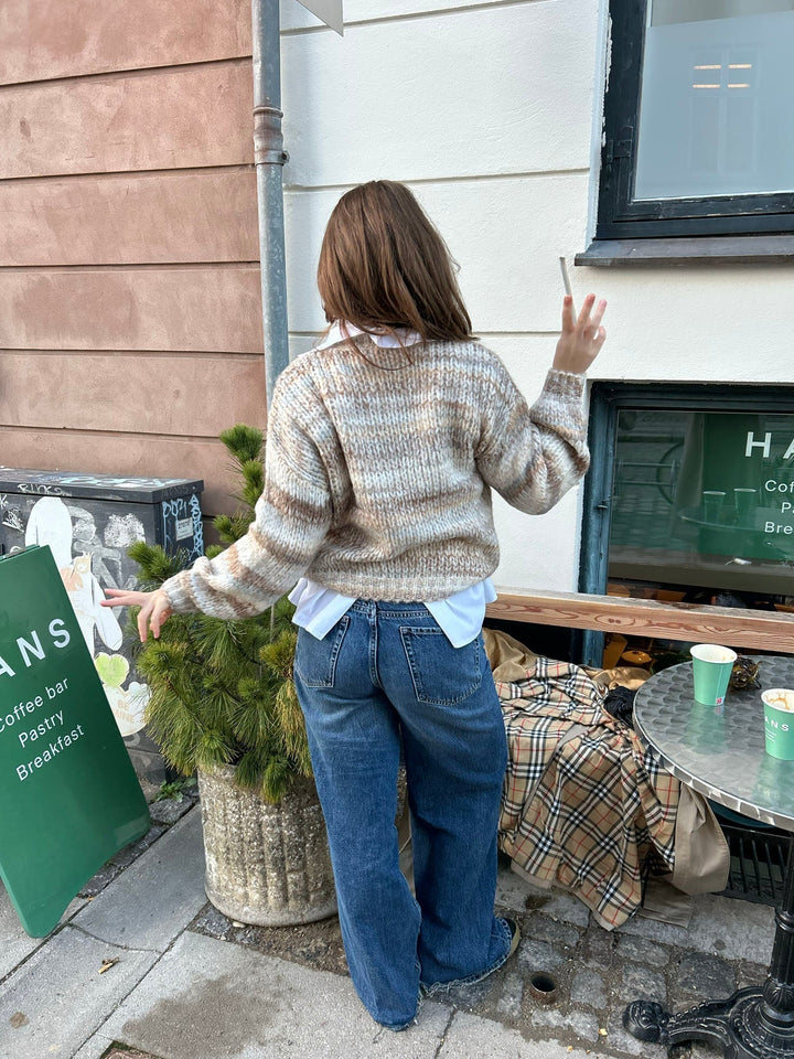 June | Women’s knit sweater with striped design