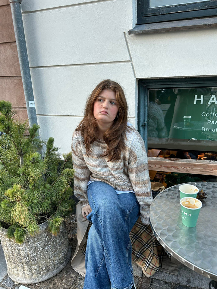 June | Women’s knit sweater with striped design