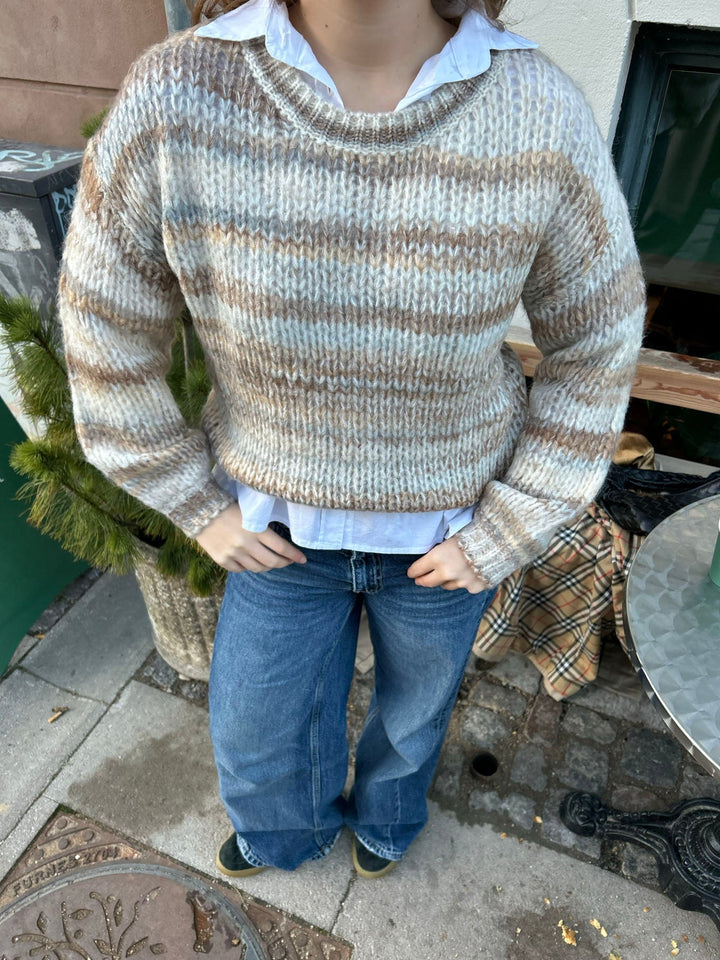 June | Women’s knit sweater with striped design