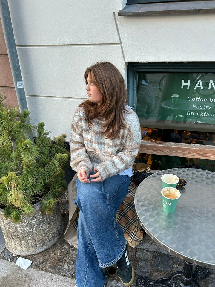 June | Women’s knit sweater with striped design