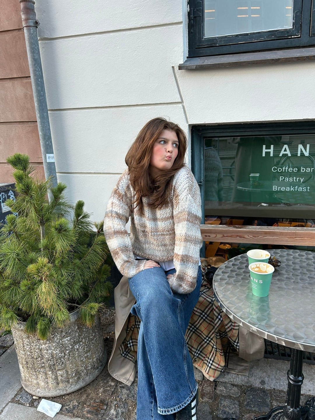 June | Women’s knit sweater with striped design