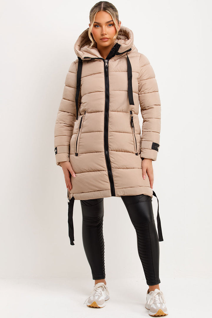 Mylenna | Women’s long puffer coat with hood and side straps